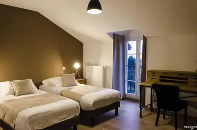Un ou plusieurs lits dans un hébergement de l'établissement Villa La Maternite