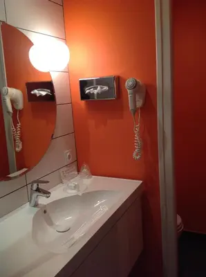 Salle de bains dans l'établissement Hôtel Vulcain