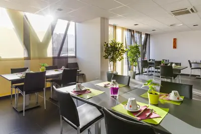 Restaurant ou autre lieu de restauration dans l'établissement Lagrange Aparthotel Lyon Lumière