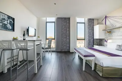 Télévision ou salle de divertissement dans l'établissement Lagrange Aparthotel Lyon Lumière
