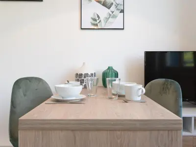 Télévision ou salle de divertissement dans l'établissement Appartements Le Berliet - Montplaisir
