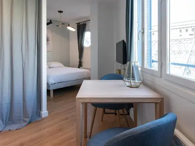Un ou plusieurs lits dans un hébergement de l'établissement Appartements Le Berliet - Montplaisir