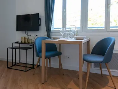 Télévision ou salle de divertissement dans l'établissement Appartements Le Berliet - Montplaisir