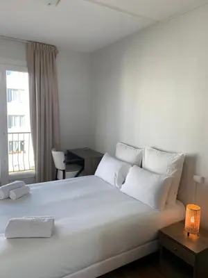 Un ou plusieurs lits dans un hébergement de l'établissement Hôtel Le Costellan