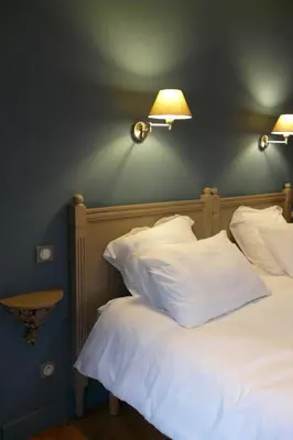 Un ou plusieurs lits dans un hébergement de l'établissement Chambres d'hôtes Du Goût et des Couleurs