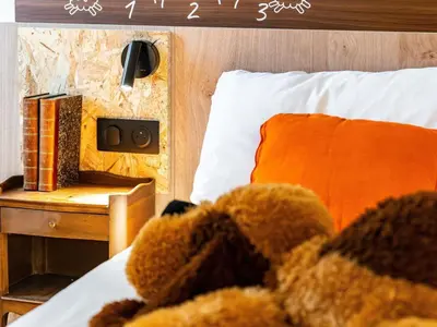 Un ou plusieurs lits dans un hébergement de l'établissement greet Hotel Massieux Lyon Nord