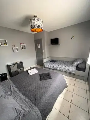 Un ou plusieurs lits dans un hébergement de l'établissement Chambres d'Hôtes Chez Florence