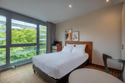 Un ou plusieurs lits dans un hébergement de l'établissement Spark by Hilton Lyon Ouest