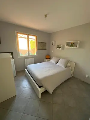 Un ou plusieurs lits dans un hébergement de l'établissement B&B Chez Jaika Chambre d hotes