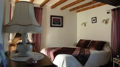 Un ou plusieurs lits dans un hébergement de l'établissement Chambres d'hôtes La Hulotte 69