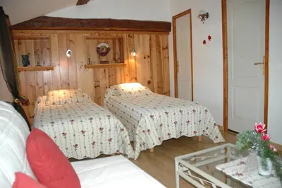 Un ou plusieurs lits dans un hébergement de l'établissement Chambres d'hôtes La Hulotte 69