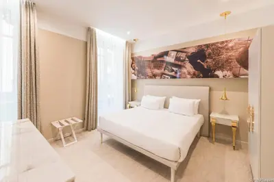 Un ou plusieurs lits dans un hébergement de l'établissement Boscolo Lyon Hotel & Spa