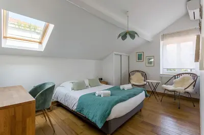 Un ou plusieurs lits dans un hébergement de l'établissement MAISON STELLA