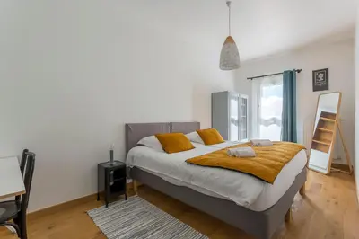 Un ou plusieurs lits dans un hébergement de l'établissement MAISON STELLA