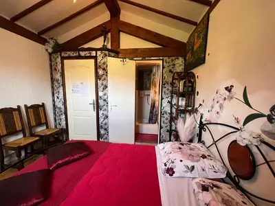 Un ou plusieurs lits dans un hébergement de l'établissement Maison d'Hôtes L'Escale Du Loup Blanc