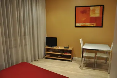 Télévision ou salle de divertissement dans l'établissement Les Studios De La Place (Part-Dieu)