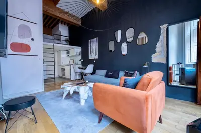 Coin salon dans l'établissement Honorê - Suite Mercière