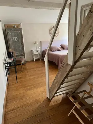Un ou plusieurs lits dans un hébergement de l'établissement Chambres d'Hôtes Mado et Lulu