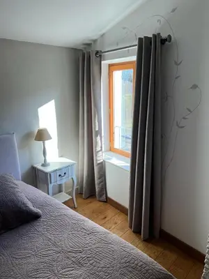 Un ou plusieurs lits dans un hébergement de l'établissement Chambres d'Hôtes Mado et Lulu