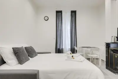Un ou plusieurs lits dans un hébergement de l'établissement GuestReady - 1-BR, 5 minutes from train station