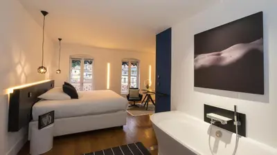 Un ou plusieurs lits dans un hébergement de l'établissement MiHotel Vieux Lyon