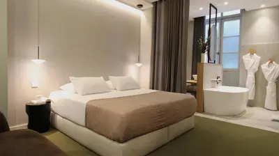 Un ou plusieurs lits dans un hébergement de l'établissement MiHotel Sala