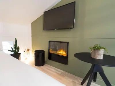 Télévision ou salle de divertissement dans l'établissement MiHotel Comte