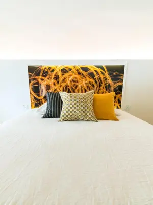 Un ou plusieurs lits dans un hébergement de l'établissement MiHotel Comte