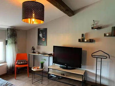 Télévision ou salle de divertissement dans l'établissement Communay Gablys Chambres