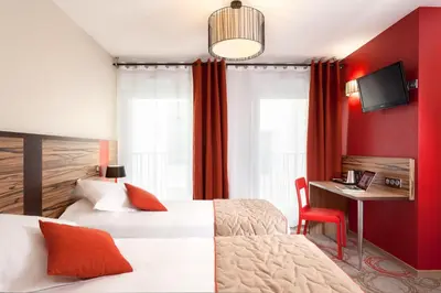 Un ou plusieurs lits dans un hébergement de l'établissement Aparthotel Adagio Lyon Patio Confluence
