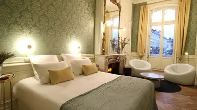 Un ou plusieurs lits dans un hébergement de l'établissement MiHotel Bellecour