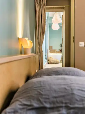 Un ou plusieurs lits dans un hébergement de l'établissement MiHotel Bellecour