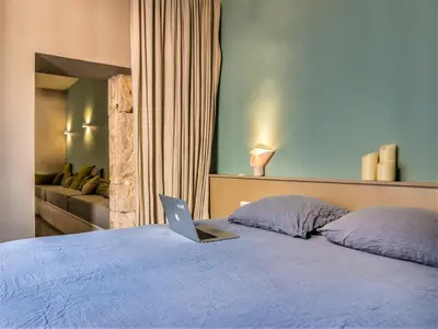 Un ou plusieurs lits dans un hébergement de l'établissement MiHotel Bellecour