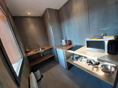 Cuisine ou kitchenette dans l'établissement Le Clos du Bois Joli