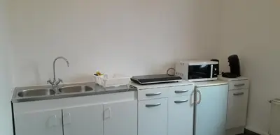 Cuisine ou kitchenette dans l'établissement Appart comme chez soi