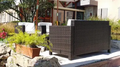 Jardin de l'établissement Logis Hotel Des Grands Vins