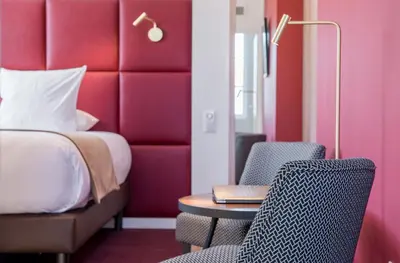 Un ou plusieurs lits dans un hébergement de l'établissement Logis Hôtel Le Tilia