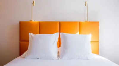 Un ou plusieurs lits dans un hébergement de l'établissement Logis Hôtel Le Tilia