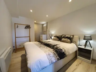 Un ou plusieurs lits dans un hébergement de l'établissement Appartement T2 proche gare et centre Bourgoin