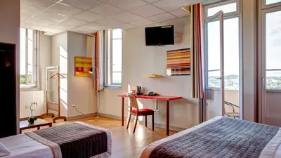 Un ou plusieurs lits dans un hébergement de l'établissement Domaine Lyon Saint Joseph