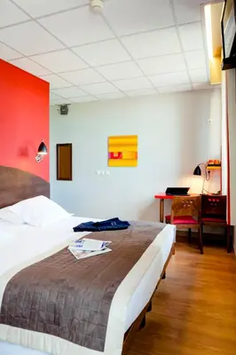 Un ou plusieurs lits dans un hébergement de l'établissement Domaine Lyon Saint Joseph