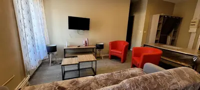 Télévision ou salle de divertissement dans l'établissement Appart hotel sathonay rillieux Lyon