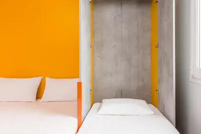 Un ou plusieurs lits dans un hébergement de l'établissement ibis budget Lyon Est Beynost