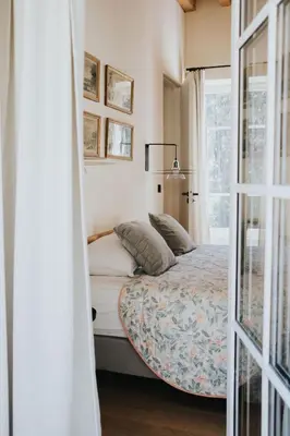 Un ou plusieurs lits dans un hébergement de l'établissement Lyon Country House - Suites & Tour de Garde