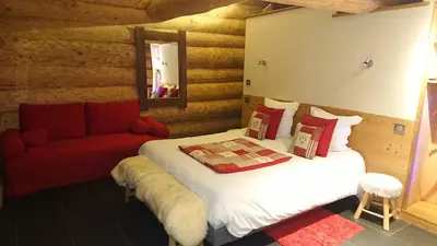 Un ou plusieurs lits dans un hébergement de l'établissement Les Chalets de Maramour