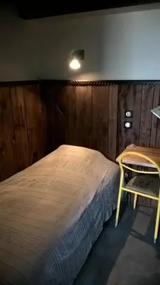 Un ou plusieurs lits dans un hébergement de l'établissement Les Chalets de Maramour