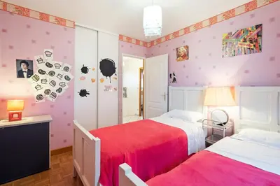 Un ou plusieurs lits dans un hébergement de l'établissement Maison chaleureuse Saint-Cyr-sur-le-Rhône