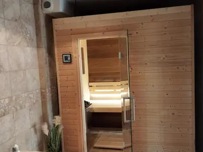 Un ou plusieurs lits dans un hébergement de l'établissement Gîte 3 chambres avec hammam, sauna et jacuzzi à Cellieu - FR-1-496-8