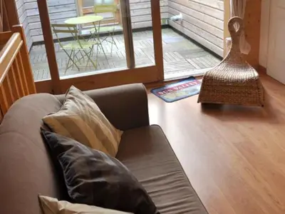 Coin salon dans l'établissement Gîte spacieux avec 2 chambres et parking à proximité du Parc du Pilat - FR-1-496-70