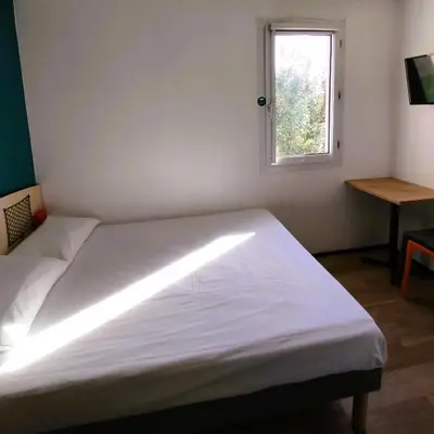 Un ou plusieurs lits dans un hébergement de l'établissement hotelF1 Lyon Bourgoin-Jallieu